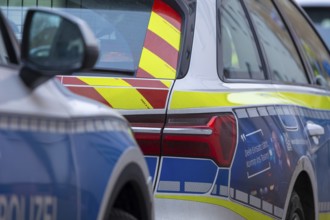 Symbolic image of police operation: close-up of police emergency vehicles