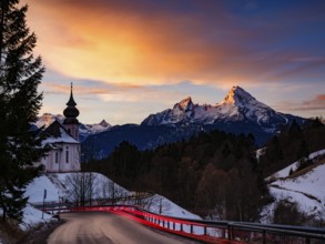Watzmann and the pilgrimage church of Maria Gern at dawn, traces of light on the road in the