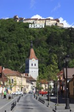 Town of Rasnov, German Rosenau. In the foreground is the distinctive clock tower of the Protestant