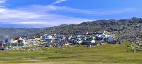 Typical architecture of Greenland Ilulissat with colored houses located near fjords and icebergs