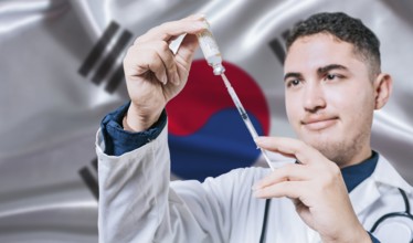 Doctor holding syringe on South Korea flag background. Medical professional holding syringe with
