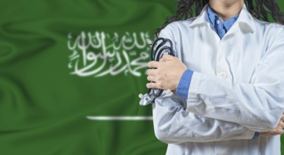 Healthcare professional with Saudi Arabia flag background. Professional doctor holding stethoscope