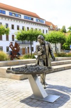 Silver figure explorer traveling by Ekaterina Kovalenko on Castle Square with bronze model of the