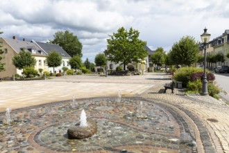 Market square with water feature in Elterlein, Ore Mountains, Saxony, Germany