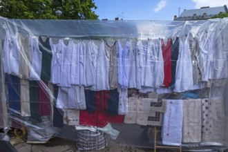T-shirts under a plastic roof, textile market in Lviv, Ukraine