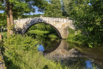 Historic arched bridge over the Mandau in Hainewalde, Upper Lusatia, Saxony, Germany