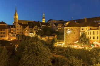 City view at night with St. Petri Cathedral, Town Hall Tower and Röhrscheidtbastei with beer