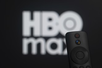 Dhaka, Bangladesh- 21 Jan 2026: Close-up of a smart TV remote control against a blurred HBO max