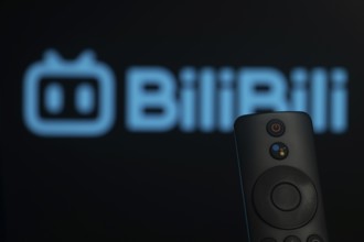 Dhaka, Bangladesh- 21 Jan 2026: Close-up of a smart TV remote control against a blurred Bilibili