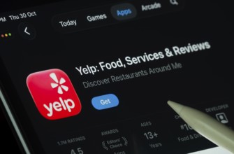 Dhaka, Bangladesh- 30 Oct 2025: Yelp app displayed on a iPad screen in dark mode with a digital pen