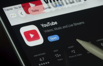 Dhaka, Bangladesh- 30 Oct 2025: Youtube app displayed on a iPad screen in dark mode with a digital