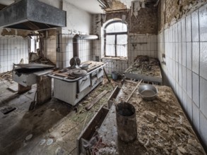 Dilapidated kitchen full of rubble in an abandoned country inn, Lost Place, Saxony-Anhalt, Germany