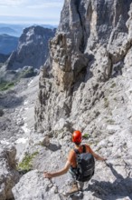 Mountaineers on the Bocchette Centrale band trail, via ferrata in the Brenta Mountains,