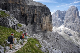 Three mountaineers on a hiking trail, rocky mountain landscape, Via Ferrata SOSAT via ferrata,