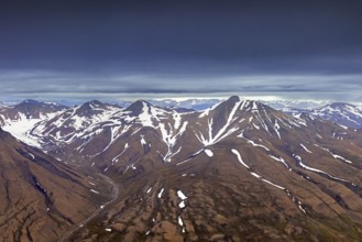 Aerial view over Adventdalen in summer, 30-kilometre valley and river Adventdalselva on the island
