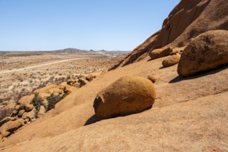 Extensive desert landscape with distinctive rock formations and endless expanse, Spitzkoppe,