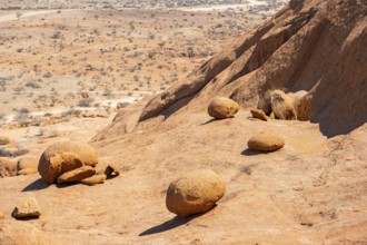 Stones and sloping rocks in a vast desert landscape, Spitzkoppe, Namibia
