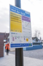 An informative sign on the platform with city and timetable information, opening of the Hermann