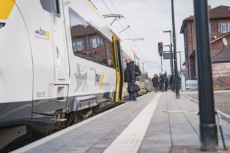 People get on a train at a municipal platform, opening of the Hermann Hesse Railway, Calw, Germany
