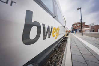 Side perspective of a train at a station with visible 'bw EGT' logo, Siemens Micro Plus B battery