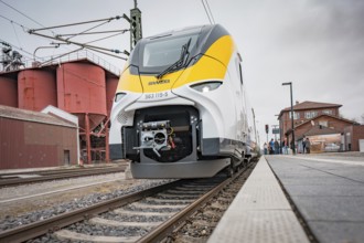 Modern train on the tracks with technical details in the foreground, Siemens Micro Plus B battery