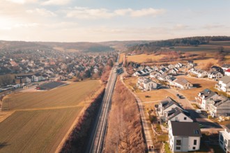 Aerial view of a village and railroad tracks in a far-reaching rural area, fire drill on the