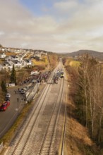 Rural railway line with crowds and a waiting train, opening of the Hermann Hesse Railway, Calw,