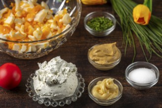 Ingredients for egg cream, such as cream cheese, sliced eggs and chives