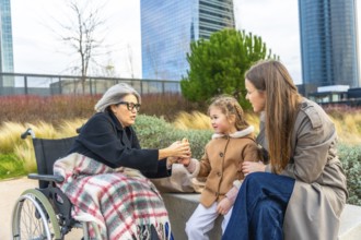 Grandmother, mother, and child sharing moments and interacting outdoors, symbolizing