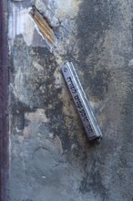 A mezuzah at an entrance to a Jewish house means door post and describes a font capsule on a door