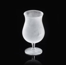 Frosted balloon glass, tulip glass against black background, studio shot
