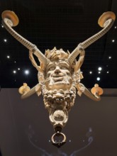 Ivory candle holder with intricate carving of a face, ivory collection, Bavarian National Museum,