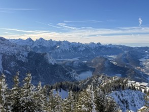 View of snowy mountain landscape of the Allgäu Alps with Alpsee, Tegelberg in winter, Schwangau,