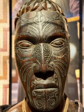 Head, carved wooden figure with artistic pattern, Maori art, Museum Five Continents, Bavaria,