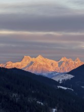 Alpine glow at sunset, mountain peaks of the Loferer Steinberge in winter, Kitzbühel Alps, Tyrol,