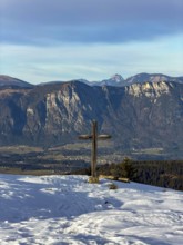 Rosskopf summit with summit cross in winter, view of Inn Valley, Kitzbühel Alps, Tyrol, Austria