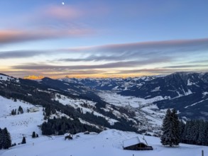 View of snowy valley and mountain landscape at sunset, Hochbrixen, Brixental, Kitzbühel Alps,