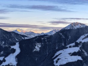 Alpine glow at sunset, Grossglockner mountain peak in winter, Brixental, Kitzbühel Alps, Tyrol,