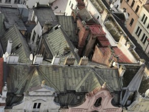 View from above of old roofs with tiles, chimneys and satellite dishes, Pilsen, Czech Republic