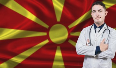 Portrait of medical professional on North Macedonia flag background. Macedonian national health