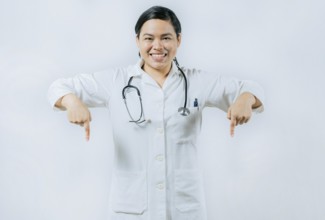 Young asian female doctor recommending an advertisement. Asian female doctor pointing at medical