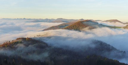 View from the Gisliflue of the Jurassic foothills covered in fog with the water fluh in the morning