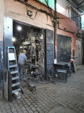 A well-stocked workshop full of cables and tools in a medina, Morocco