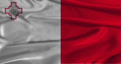 Flag of Malta with fabric textured background. Close up of National flag of Malta with realistic