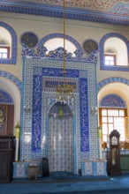 Detailed view of a richly decorated prayer niche in light blue tiles, Kapu Mosque, mosque from the