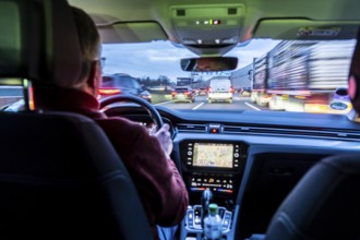 Driving on the A40 motorway, Ruhrschnellweg, in heavy traffic, drivers' perspective, Essen, North