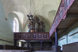 Interior with baroque organ of the abandoned 16th century Protestant fortified church, Tobsdorf,