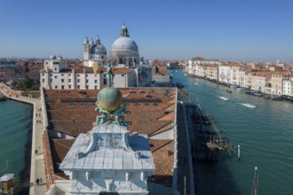 Drone footage of the Dogana da Mar, moving wind vane of Saint Fortuna on a gilded globe carried by