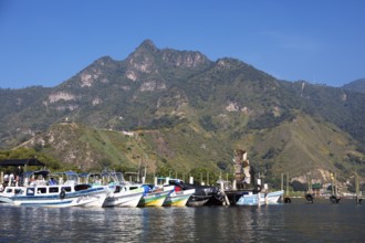 Colourful boats in the port of San Juan la Laguna, the mountains behind, Atitlán, Sololá