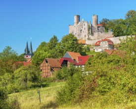 View of the ruins of Hanstein Castle and the small village of Rimbach, half-timbered houses and
